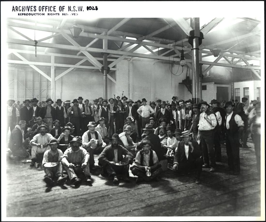 Interior of warehouse showing workers at lunch (7750025594)